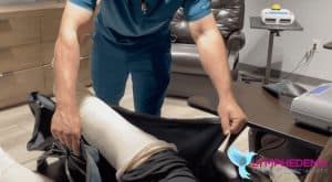 technician-applying-compression-bandages-1